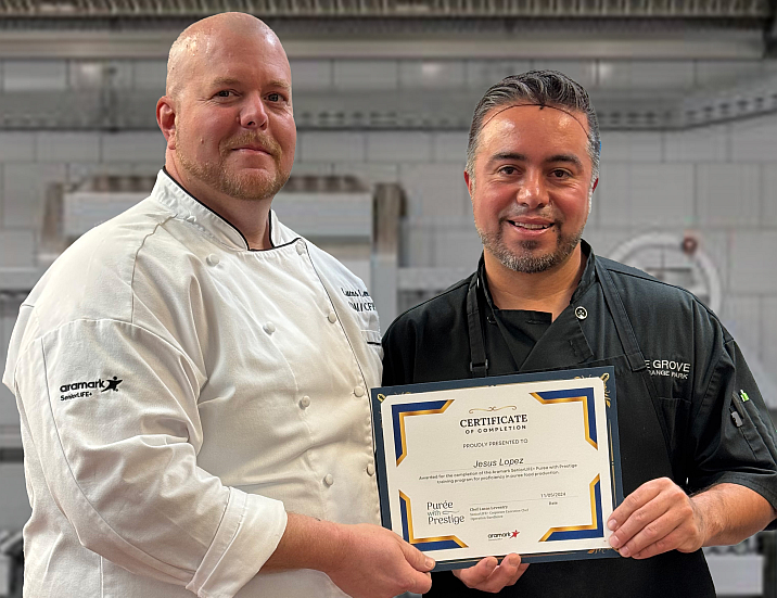 chef and employee with training certificate